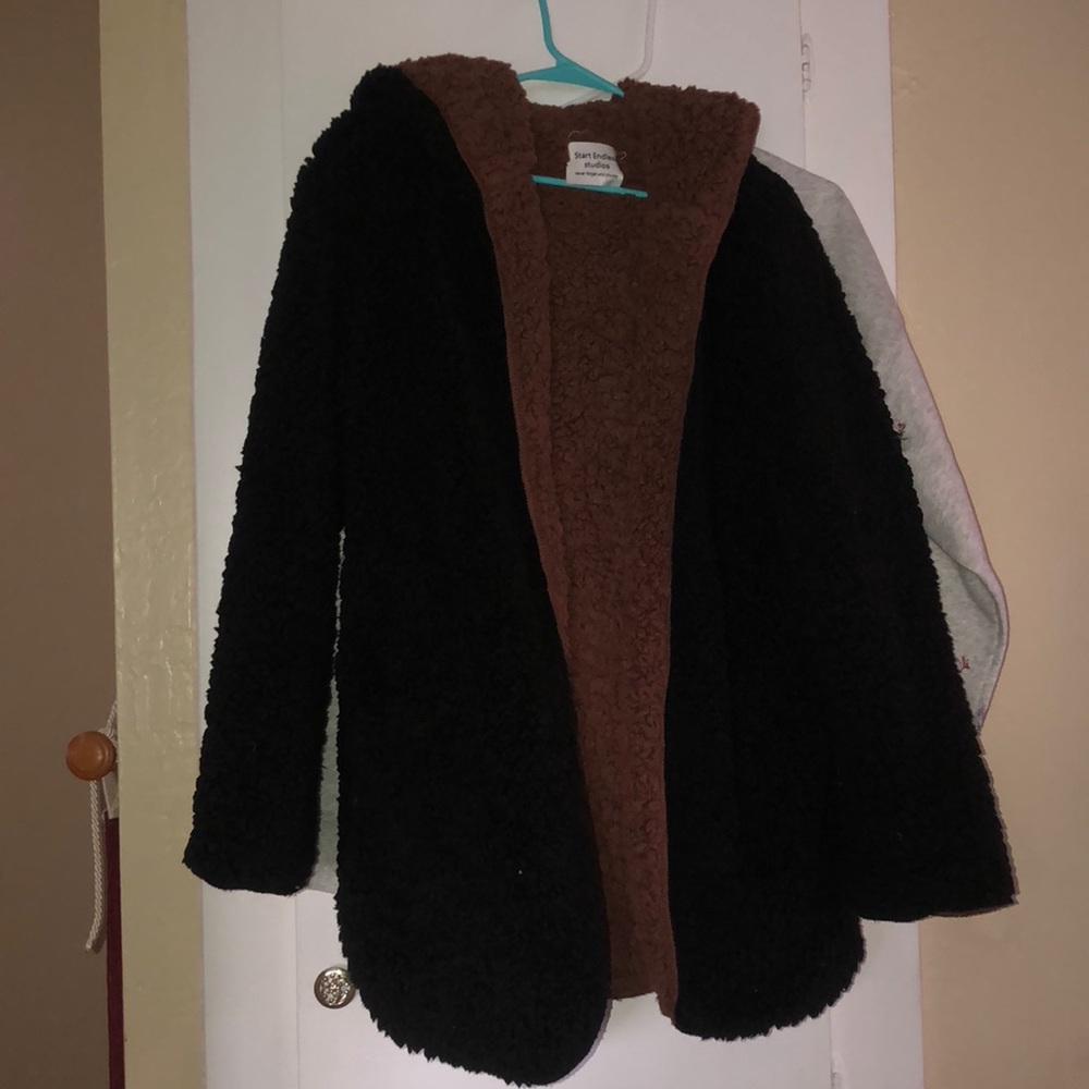 Black and brown fuzzy coat